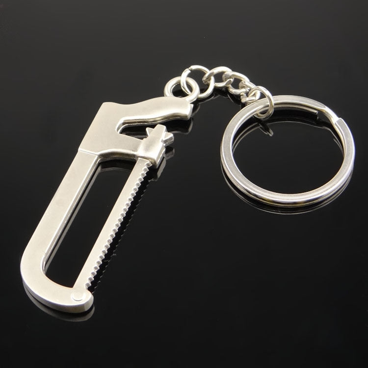 10 PCS Tool Metal Keychain Car Key Ring Pendant, H-540 Activity Wrench, H-389 Hex Wrench, H-391 Glossy Ax, H-388 Thread Ax, H-395 Double Head Wrench, H-405 Double Row Saw, H-402 Hand Saw, H-541 Crooked Nose Pliers, H-399 Pliers, X-396 Vise, H-556 Shove...