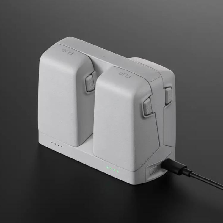 وحدة الشحن المتوازية الأصلية DJI Flip يمكنها تخزين وشحن بطاريتين، وحدة الشحن المتوازية Flip